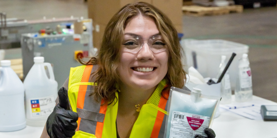 Female work smiling with Clario bag