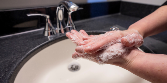 Hands being washed with foaming soap