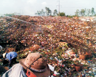 Spraying of solution onto garbage